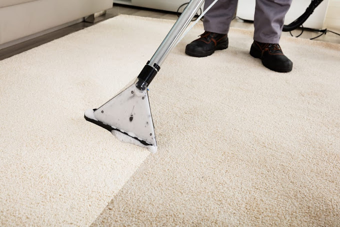 Carpet cleaning technician performing hot water extraction on residential carpet in Austin, TX